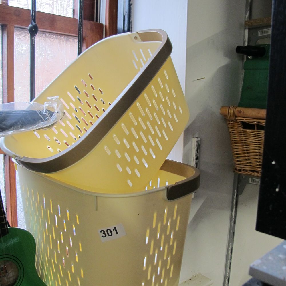 Lot 301: A Collection of Yellow Plastic Laundry Baskets with...