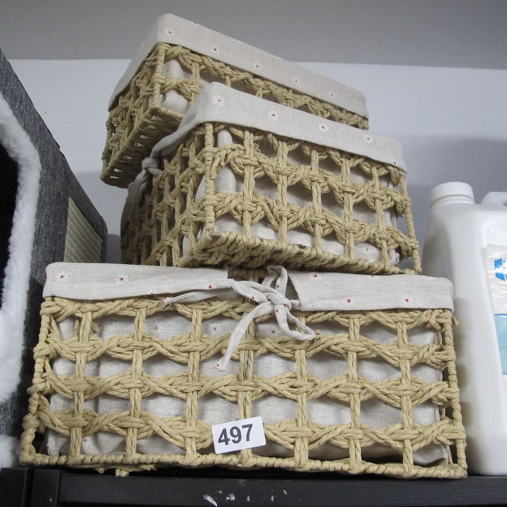 Lot 497: A Trio of Woven Paper Cord Storage Baskets...