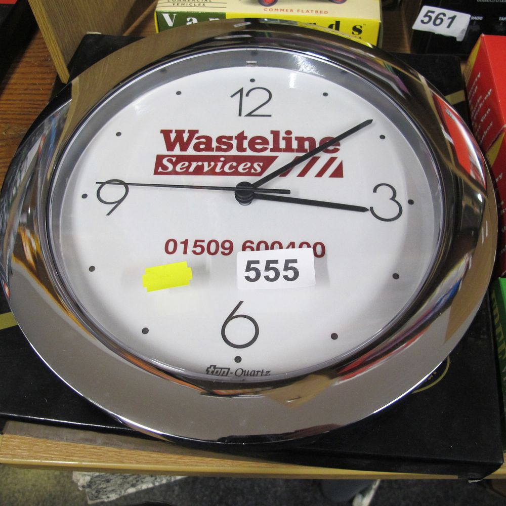 Lot 555: A Contemporary Chrome-Finished Promotional Wall Clock for Wasteline...