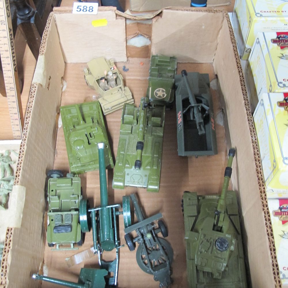 Lot 588: An Assortment of Plastic Toy Military Vehicles and...