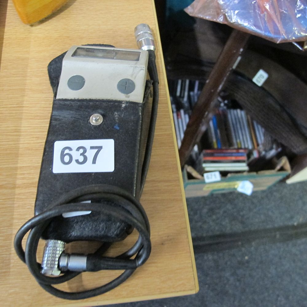 Lot 637: A Digital Electronic Handheld Testing Device in a...