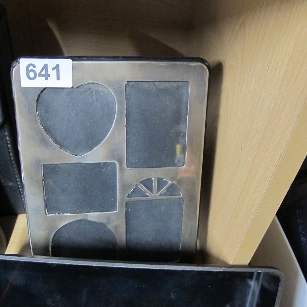 Lot 641: A Polished Silver-Toned Metal Multi-Aperture Photograph Frame