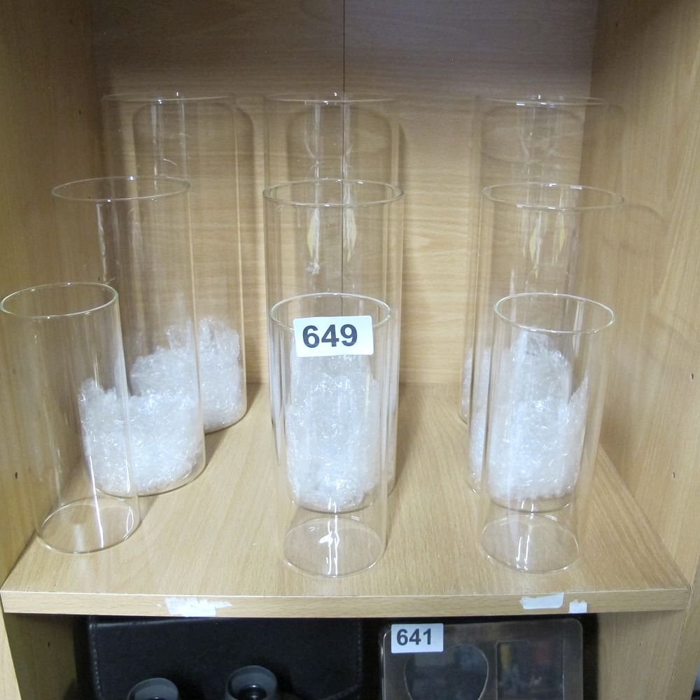 Lot 649: A Collection of Clear Glass Cylinder Vases and...