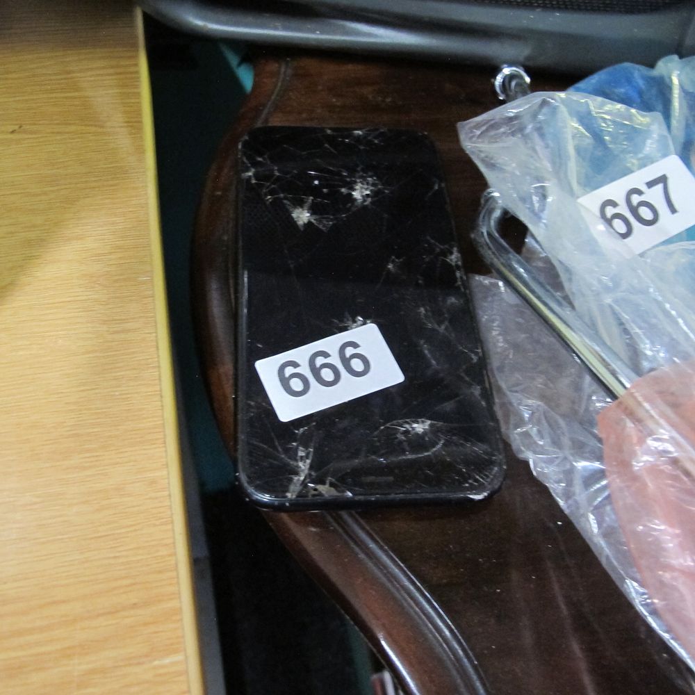 Lot 666: A Black Apple iphone 8 Smartphone with Cracked...