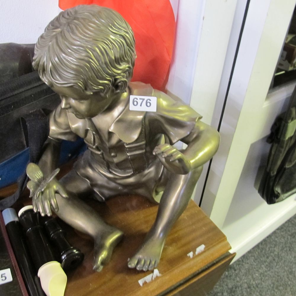 Lot 676: A Bronze Patinated plastic Figurine of a Boy...