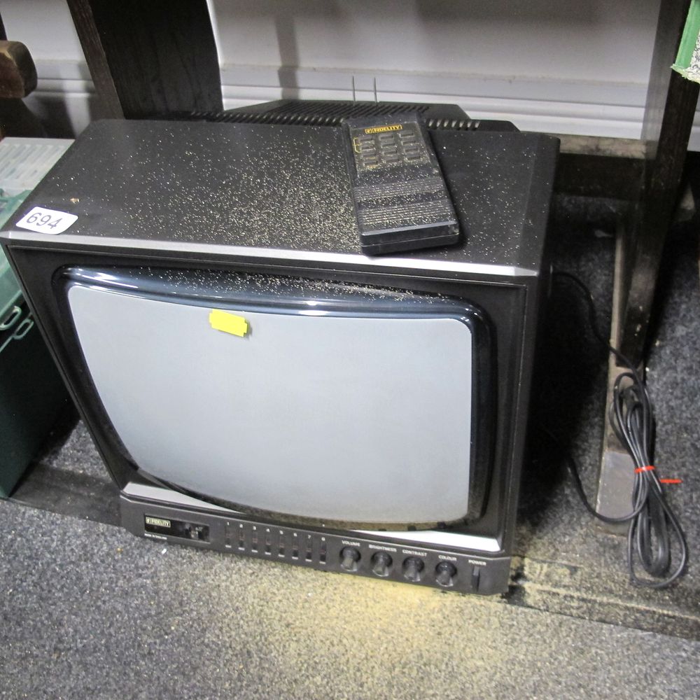 Lot 694: A Vintage Fidelity Portable CRT Television with Remote...