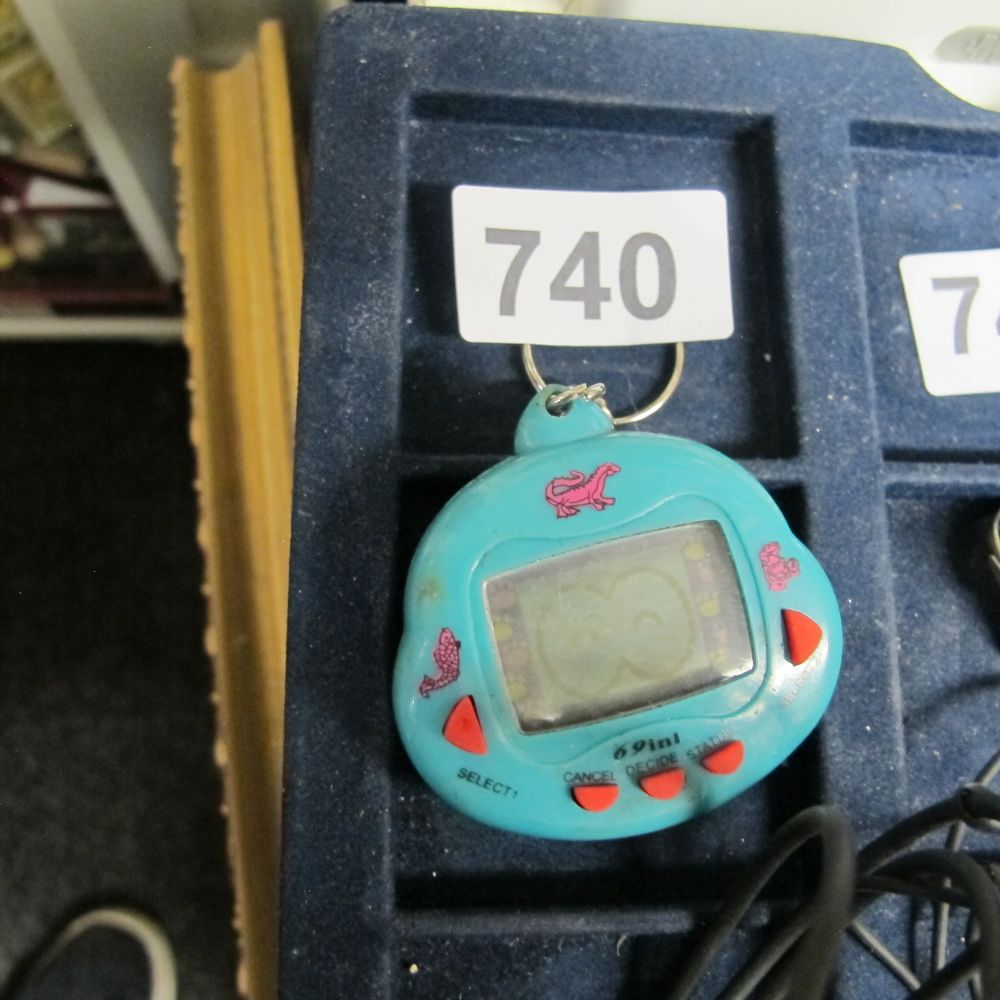 Lot 740: Dinkie Dino 69 in 1 Electronic Virtual Pet...