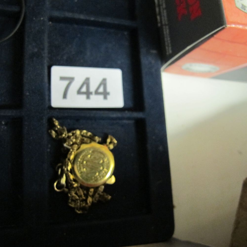 Lot 744: A medical Gold-Toned Pendant Necklace