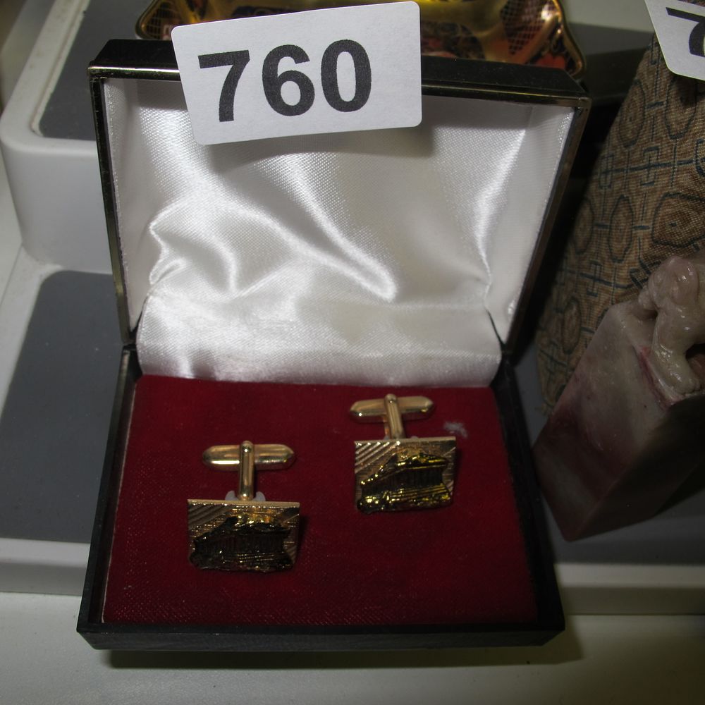Lot 760: A Pair of Gold-Tone Souvenir Cufflinks