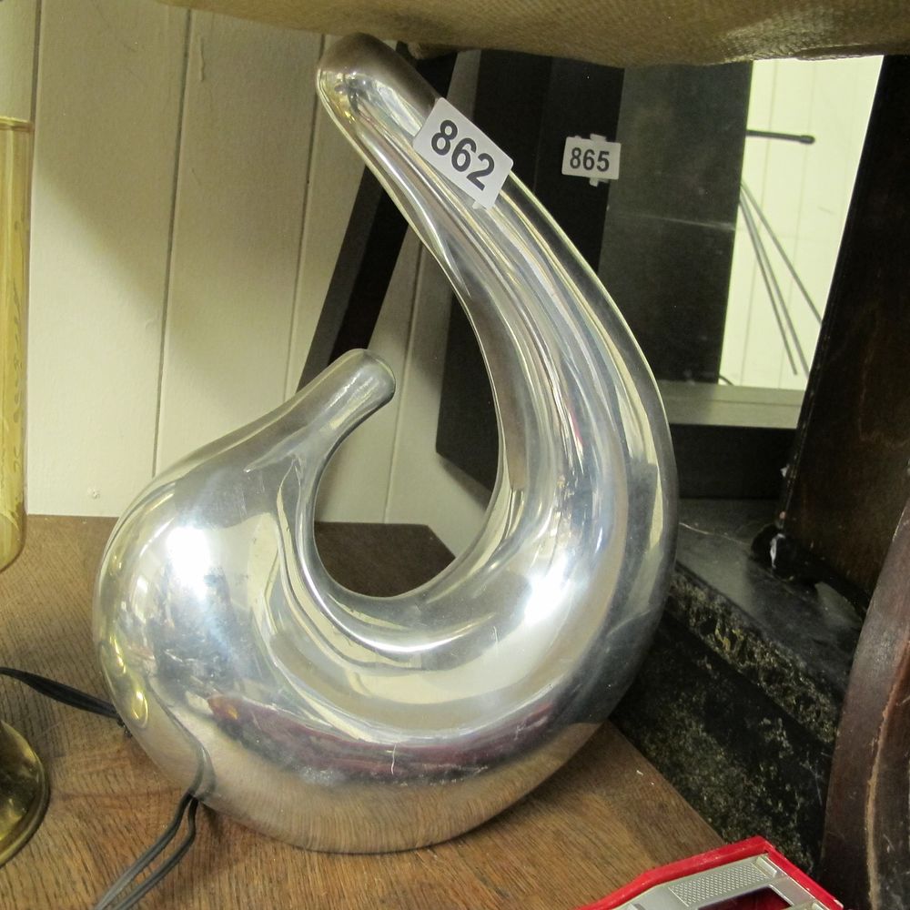 Lot 862: Italian Modernist Clef Style Polished Aluminum Table ornament