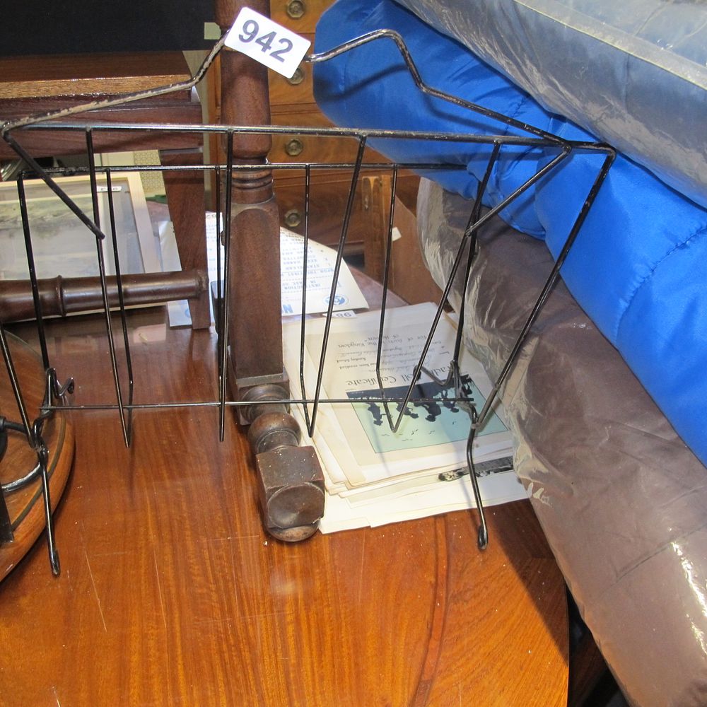 Lot 942: A Mid-Century Style Black-Coated Metal Wire Storage Rack