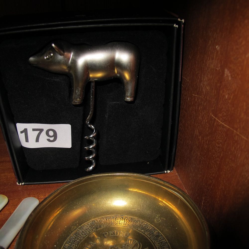 Lot 179:  a Chrome Novelty Pig Corkscrew and a Brass...