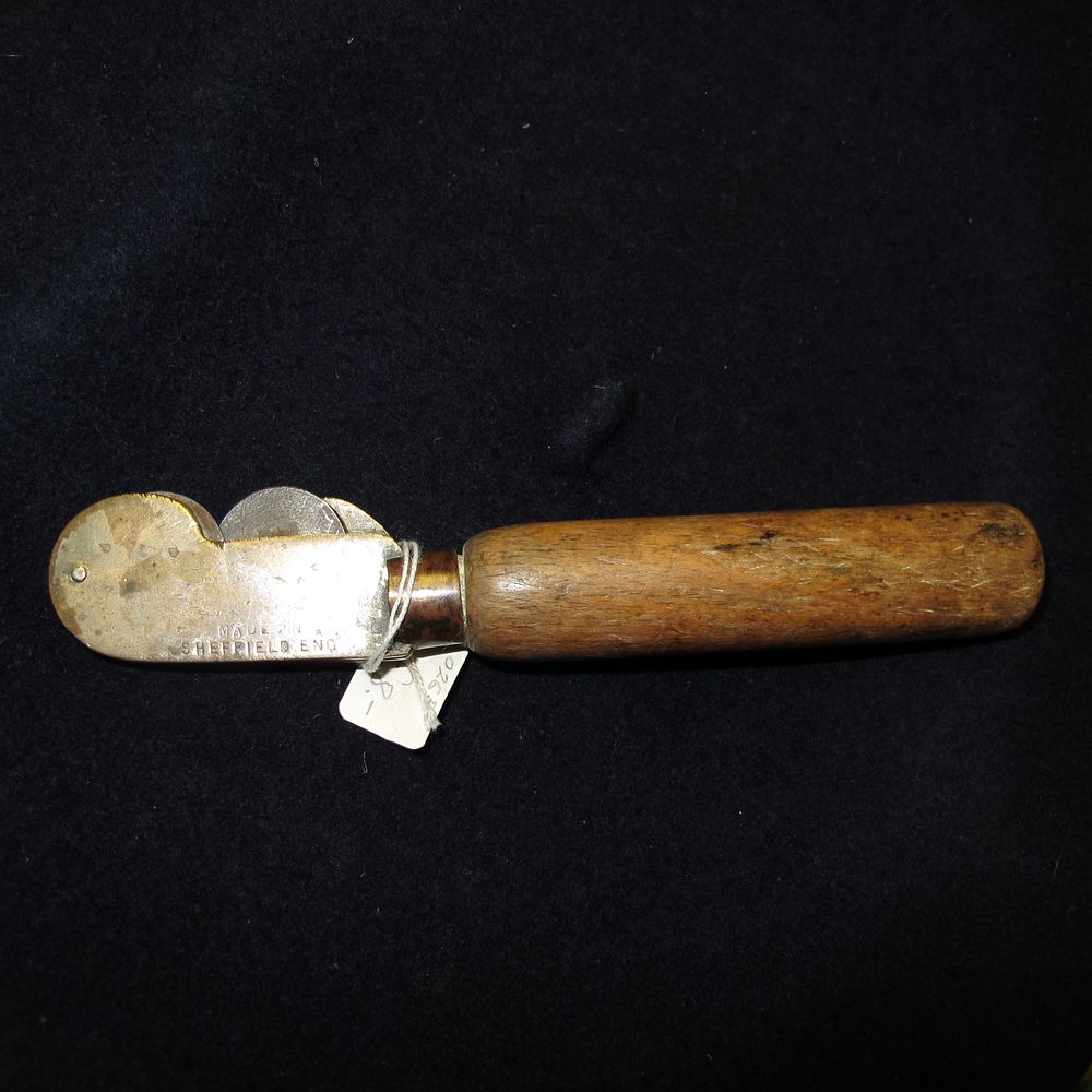 Lot 185: A Mid-20th Century Sheffield Made Handheld Knife Sharpener...