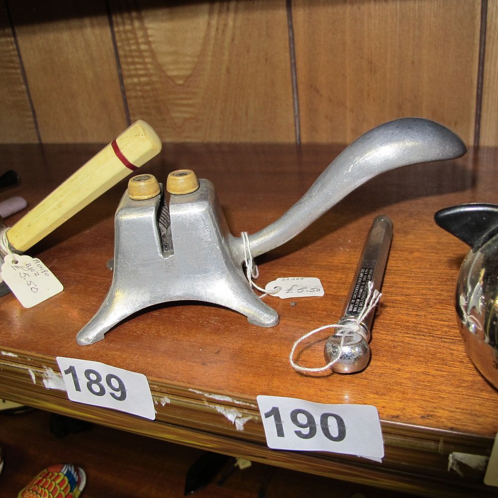 Lot 189:  A vintage bar top knife sharpener