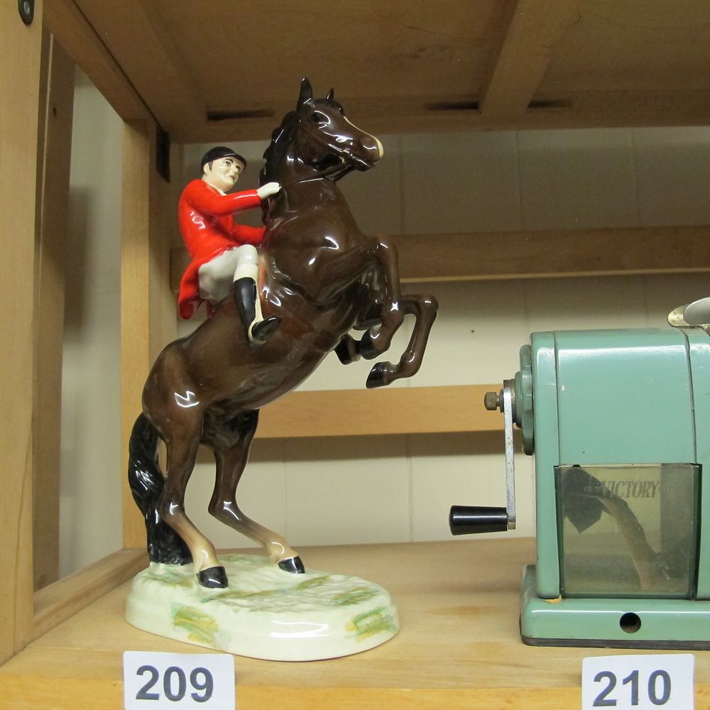 Lot 209: A Beswick Glazed Ceramic Figurine of a Huntsman...