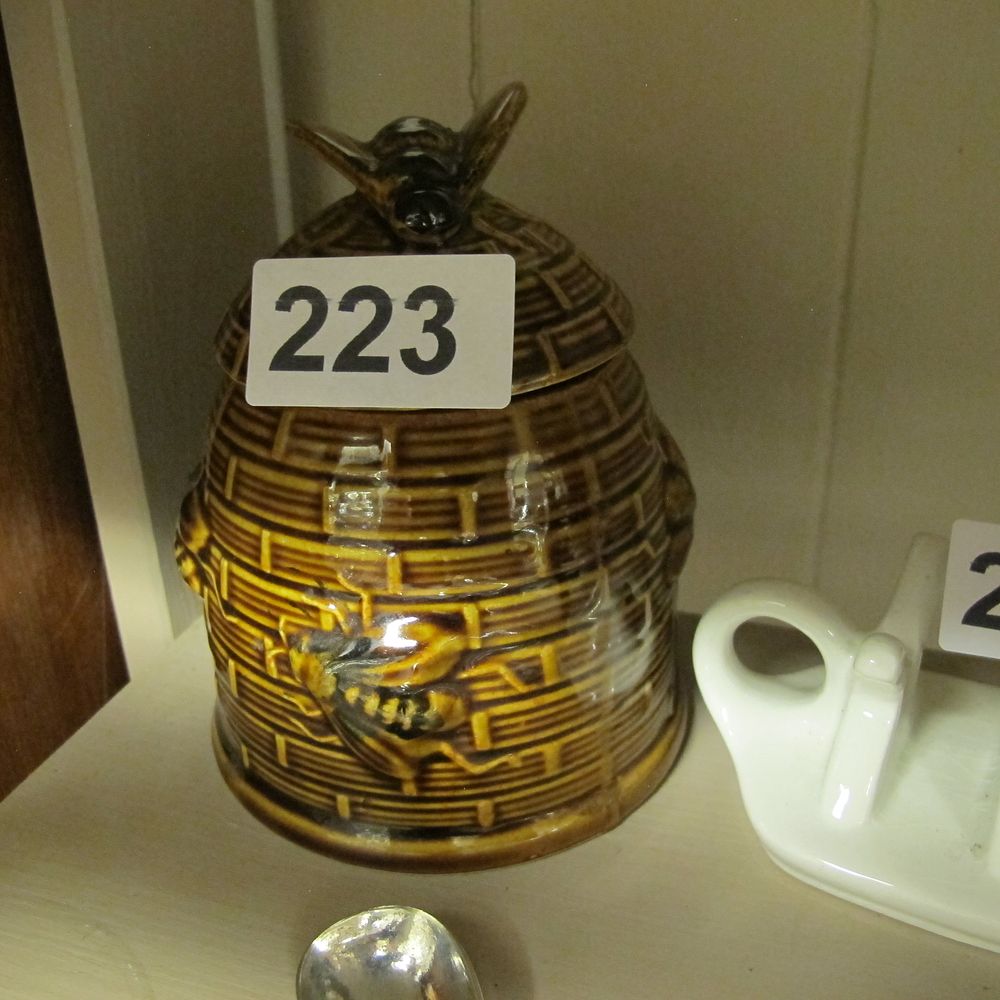 Lot 223: A vintage glazed earthenware beehive form honey pot...