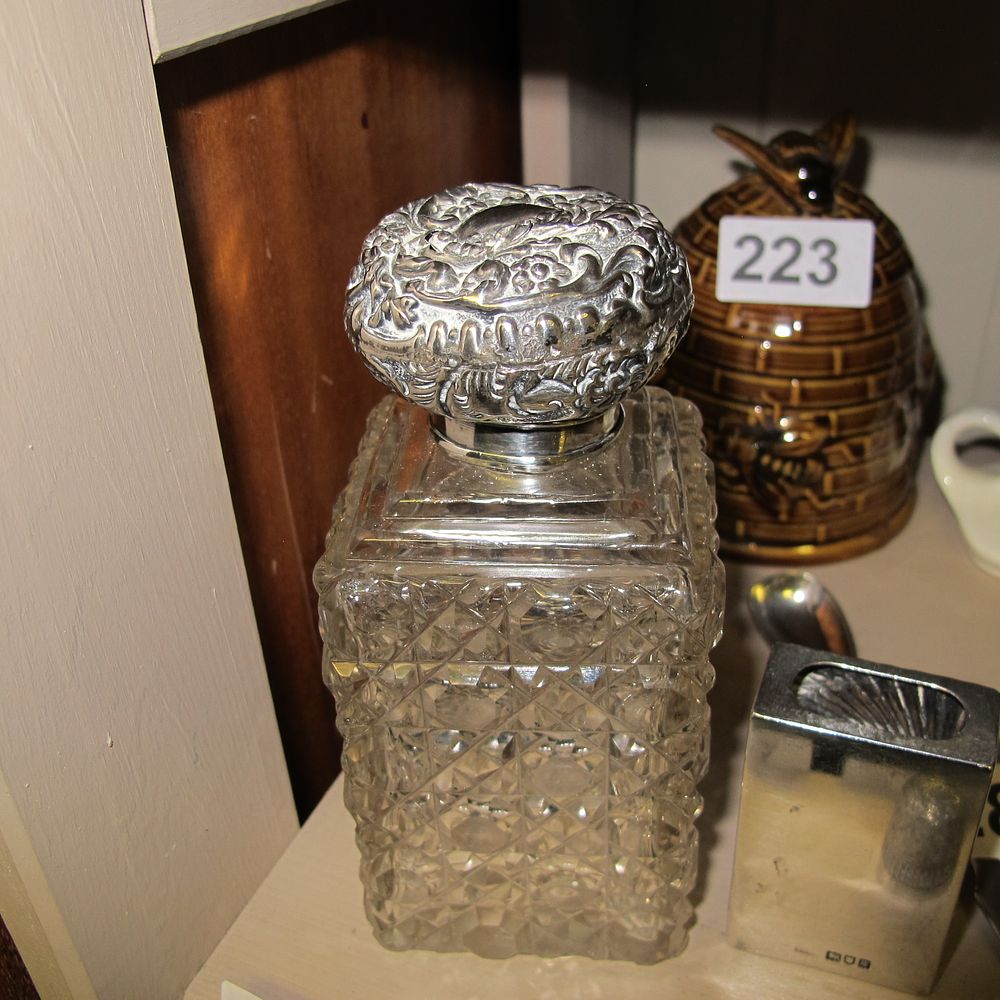 Lot 226: Antique sterling silver cap cut crystal perfume bottle