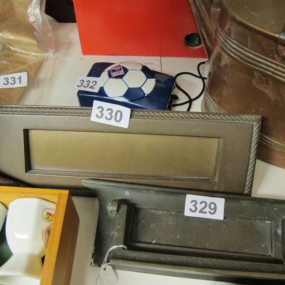 Lot 330: A solid brass letter box 