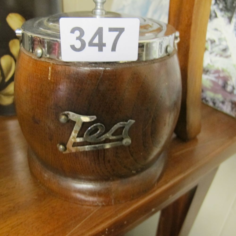 Lot 347: A vintage English oak barrel-form tea caddy with...