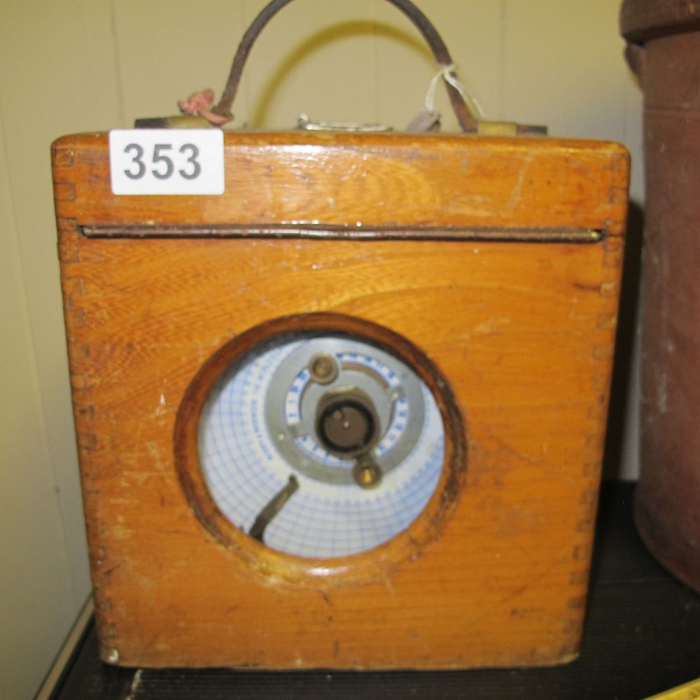 Lot 353: A Vintage Pigeon Racing Clock in a Wooden...