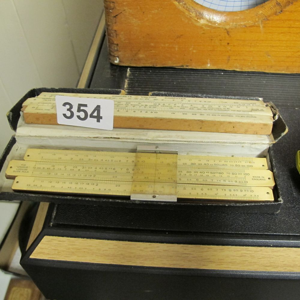 Lot 354: A Pair of Vintage British Slide Rules including...