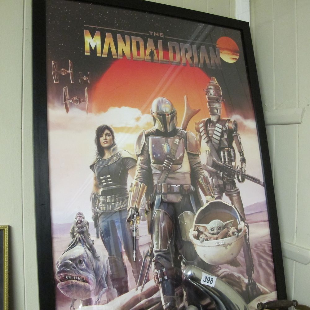 Lot 396: A Framed Trends International Star Wars The Mandalorian...