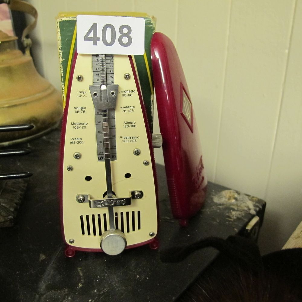 Lot 408: A Wittner Taktell Piccolo Mechanical Metronome in Maroon