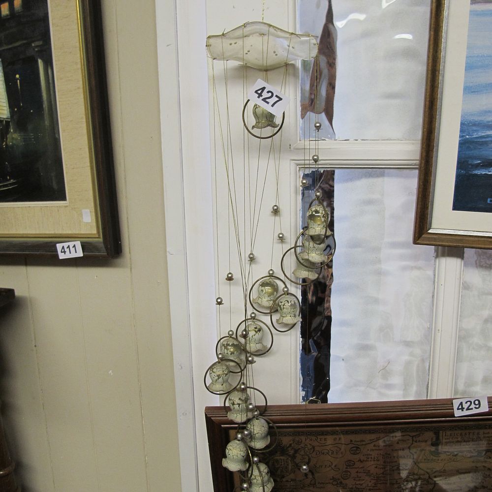 Lot 427: A contemporary kinetic glass and brass tone wire...