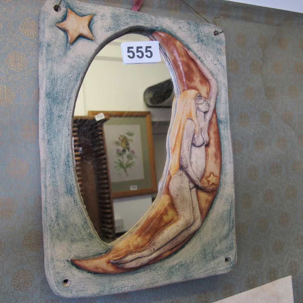 Lot 555: A Studio Ceramic Celestial Theme Wall Mirror Plaque