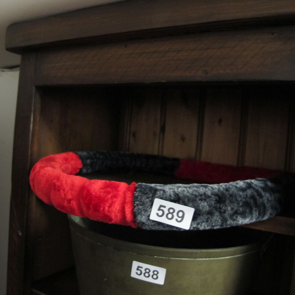 Lot 589: Two items comprising a bicolour plush steering wheel...