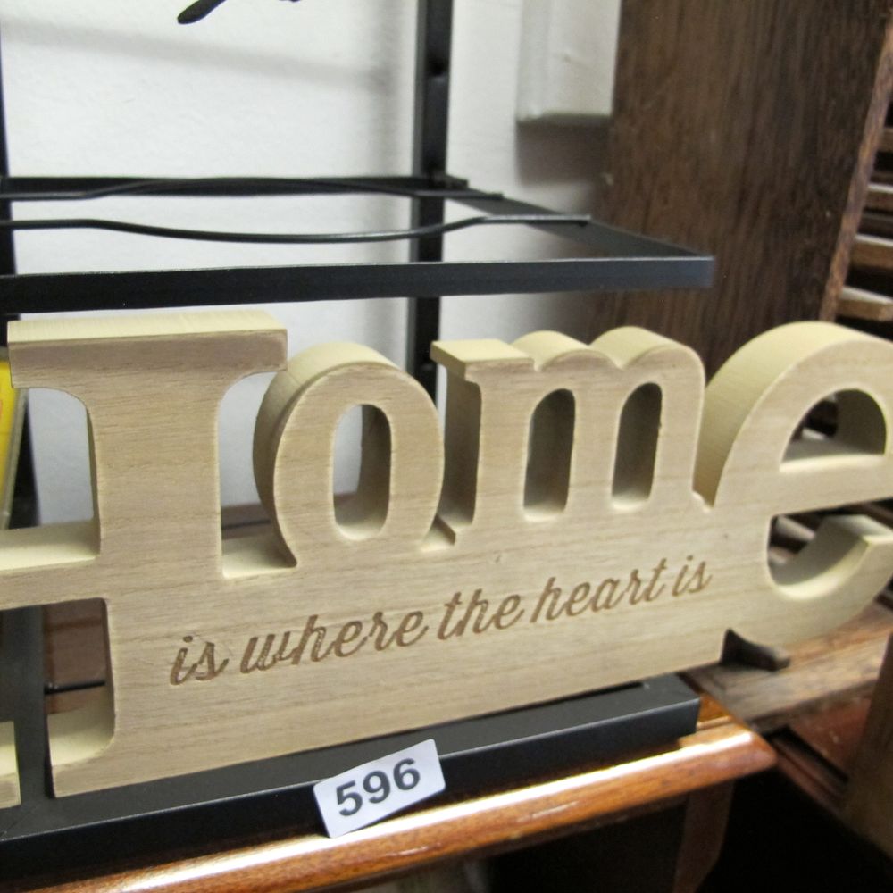 Lot 595: A contemporary freestanding wooden Home decorative sign
