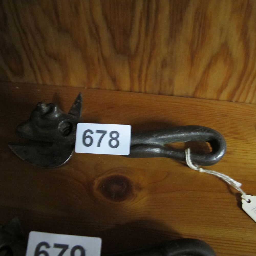 Lot 678: An antique cast iron figural bull head can...