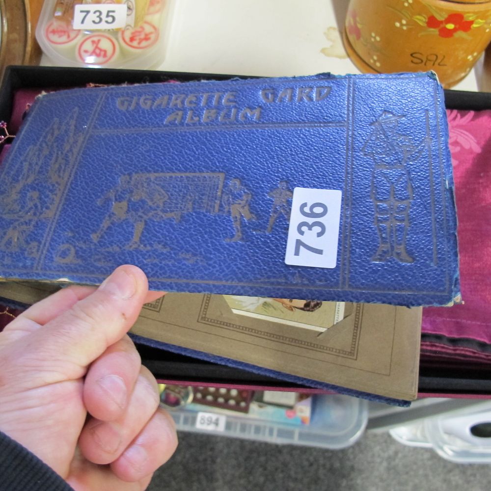 Lot 736: A mid-20th-century cigarette card album and contents
