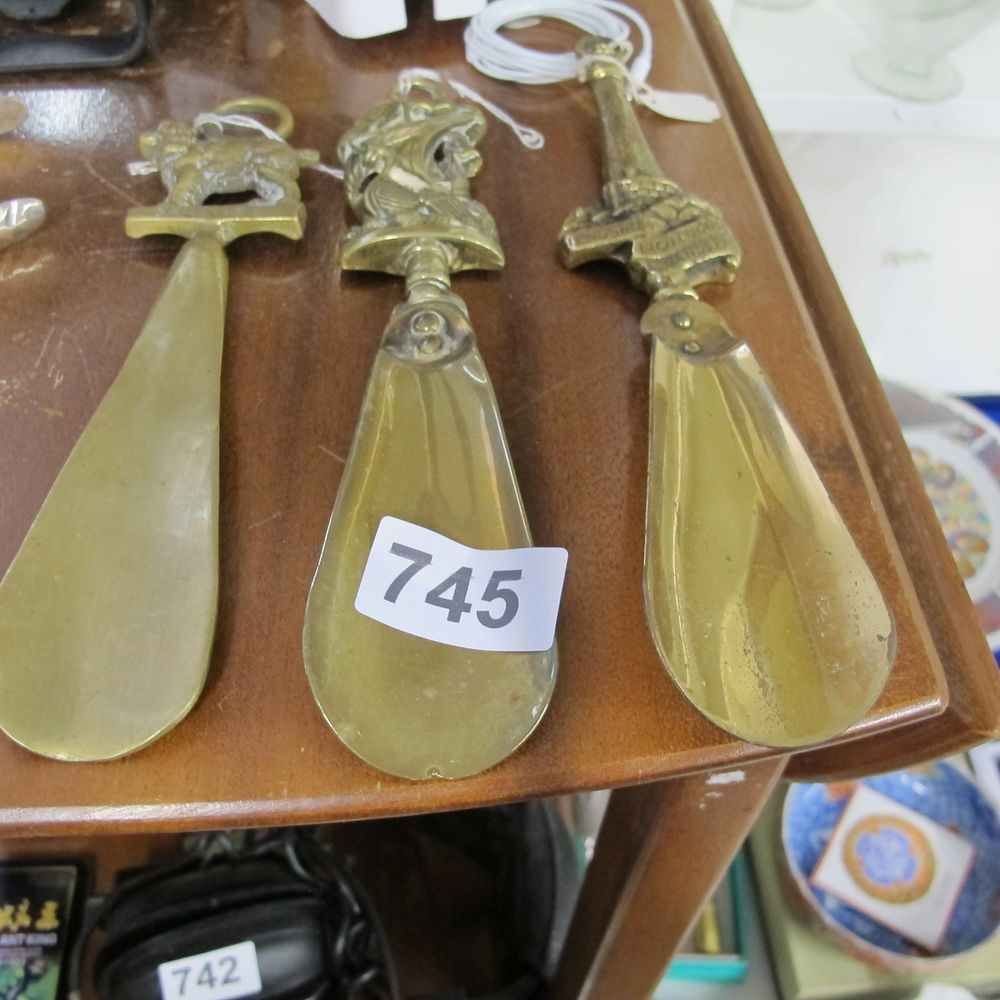 Lot 745: A Trio of Vintage English Brass Shoehorns with...