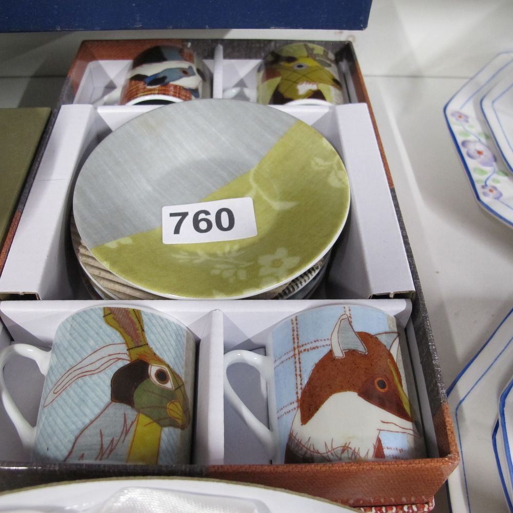 Lot 760: A set of four ceramic espresso cups and...