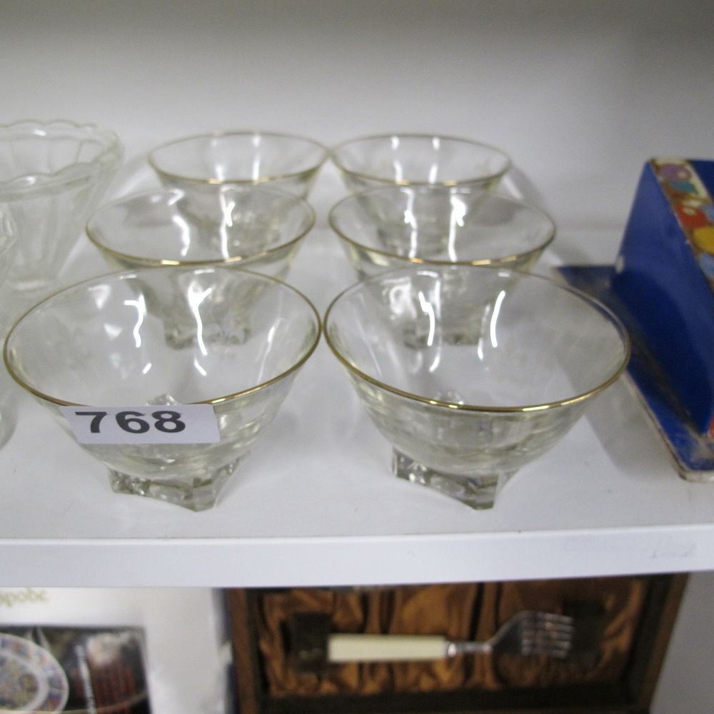 Lot 768: A set of six clear pressed glass dessert...