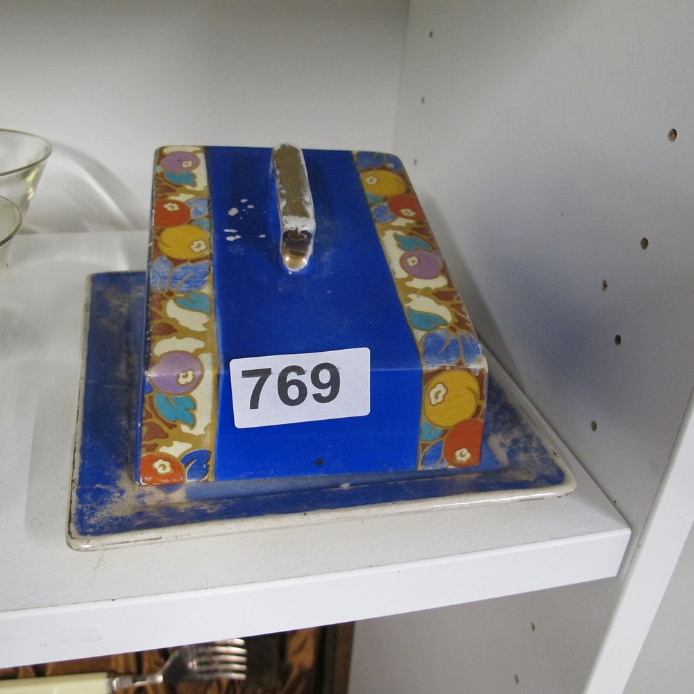 Lot 769: An Art Deco earthenware covered butter dish with...