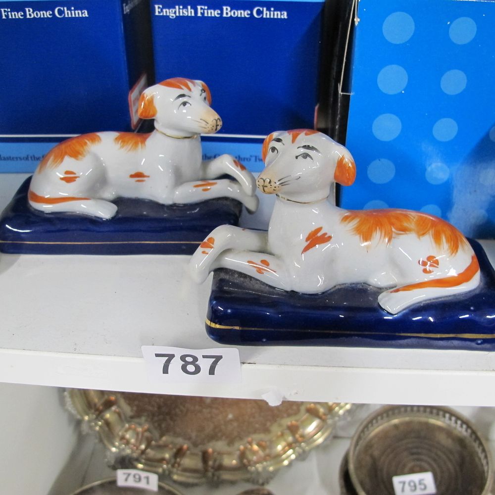 Lot 787: A Pair of English Fine Bone China Reclining...
