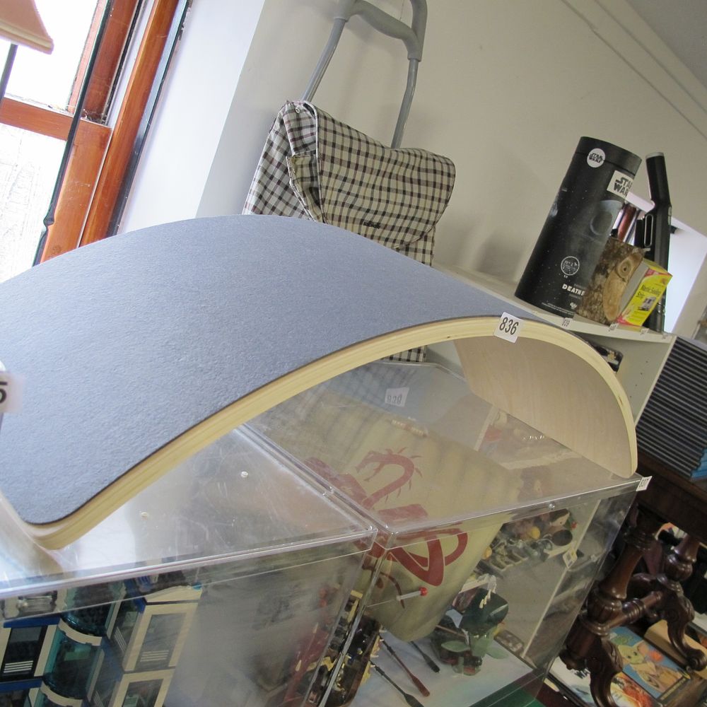 Lot 836: A Curved Laminated Plywood Balance Board with Blue...