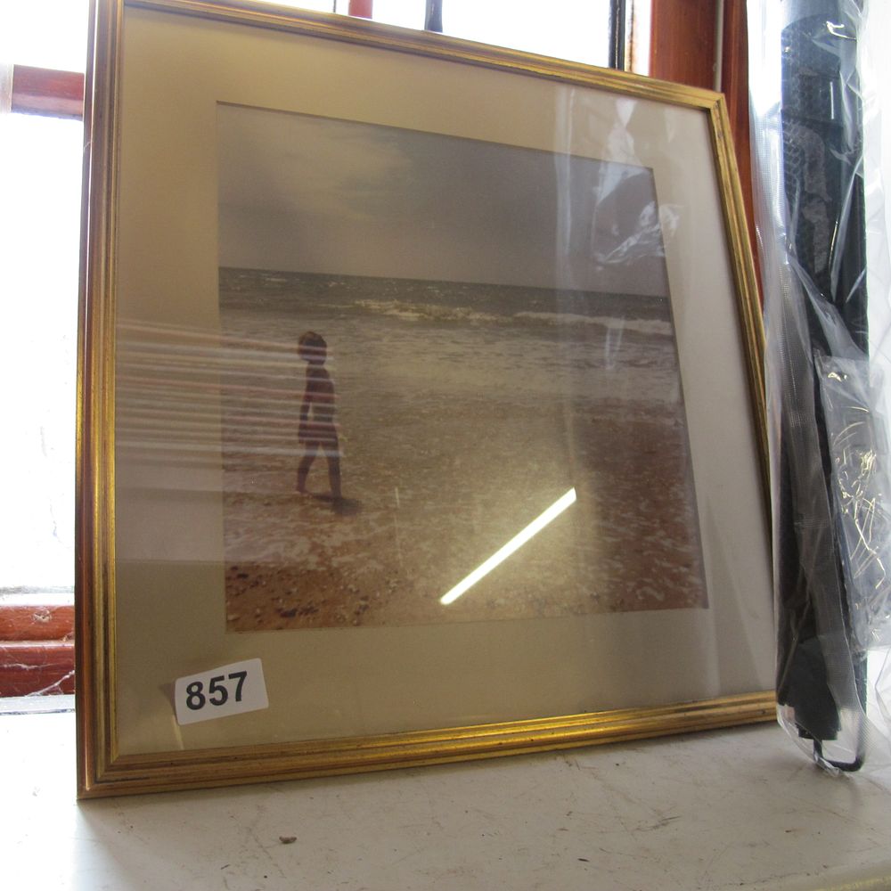 Lot 857: A framed modern chromogenic print depicting a child...