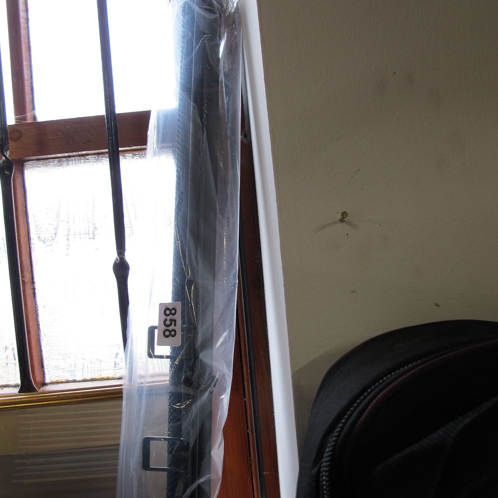 Lot 858: A pull down car sun screen