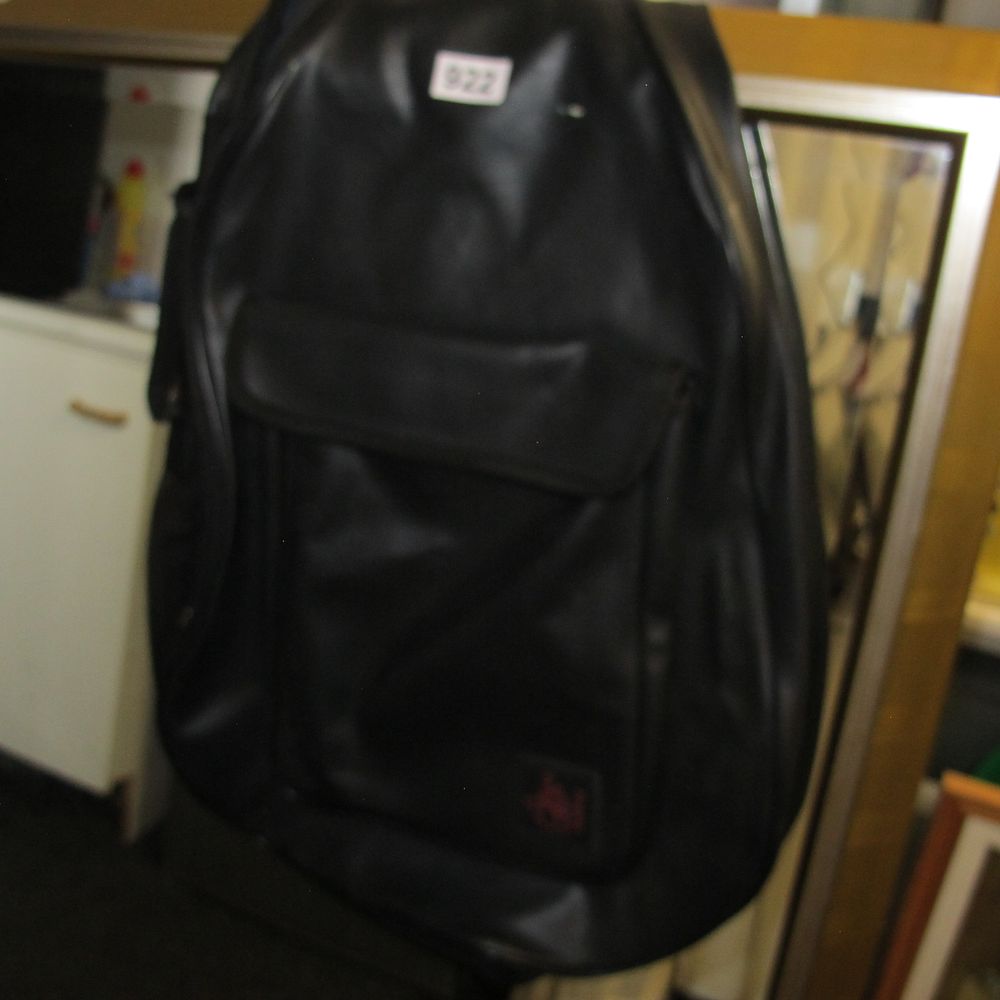 Lot 922: A black teardrop-shaped synthetic guitar case