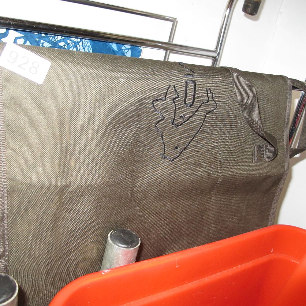Lot 928: A Fox International olive-green synthetic fishing accessory