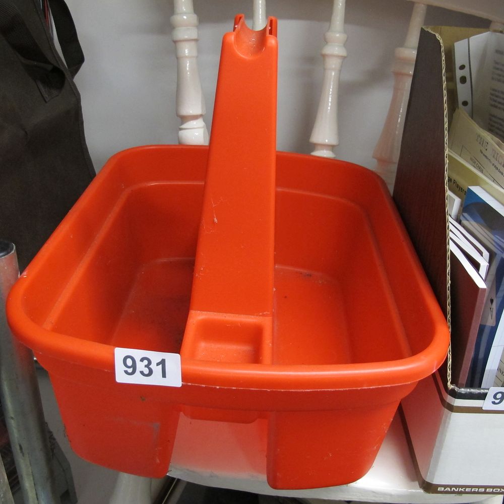 Lot 931: A Mid-Century Style Orange Moulded Plastic Utility Caddy