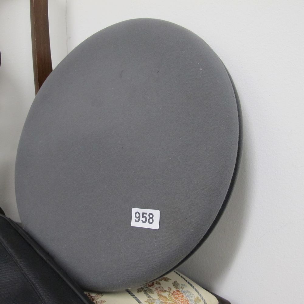 Lot 958: A circular grey fabric seat cushion