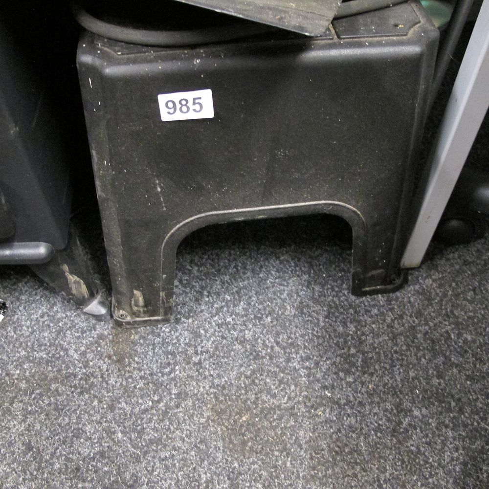 Lot 985: A black moulded plastic one-step stool