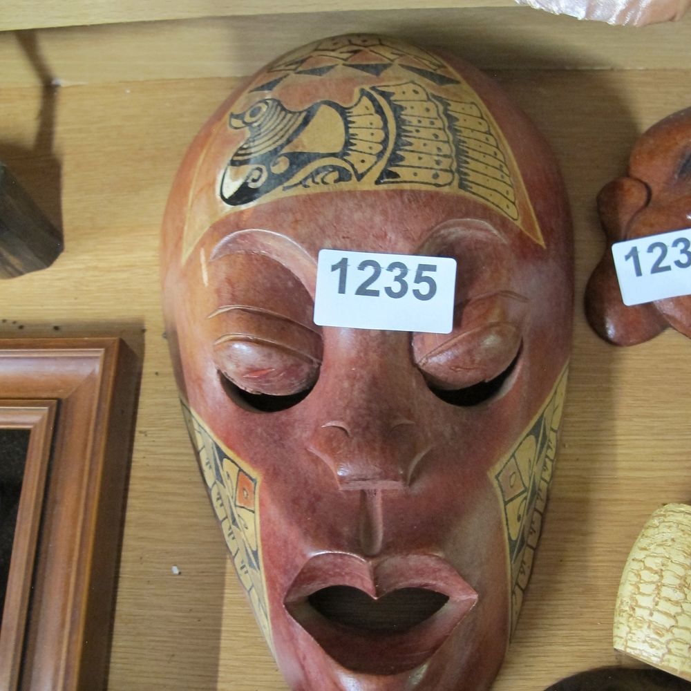 Lot 1235: A Carved Polychrome Stone Mask in the Pre-Columbian...