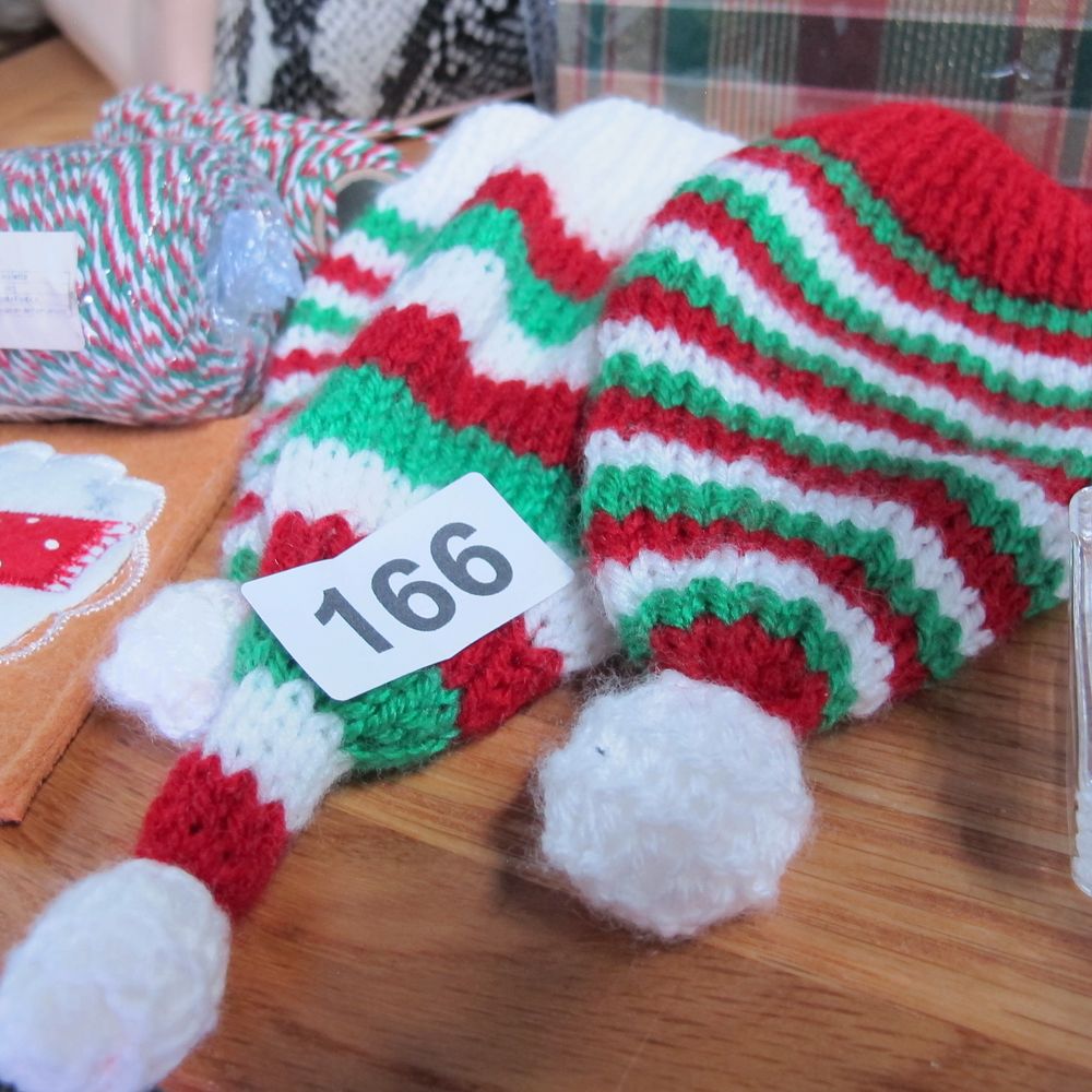 Lot 166: A Collection of Festive Miniature Knitted Elf Hats...