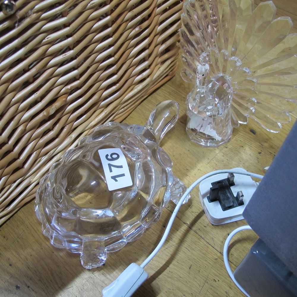 Lot 176: Two clear glass animal figurines comprising a peacock...