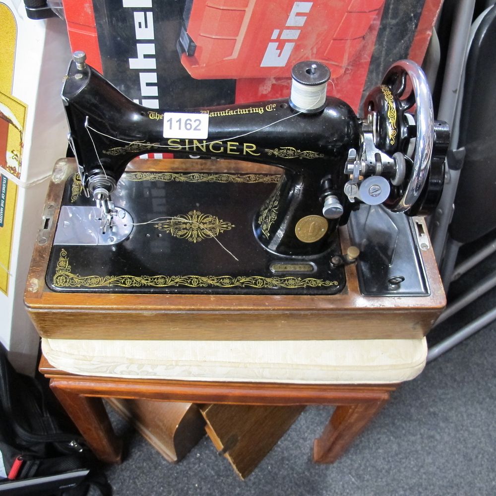 Lot 1162: A Singer Model 99K Electric Portable Sewing Machine,...